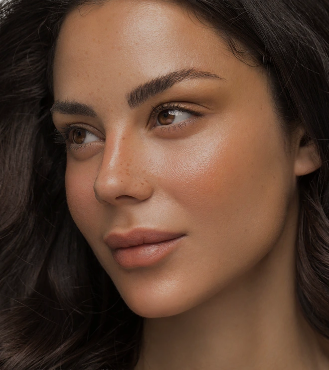 Close-up of a woman with smooth, glowing skin