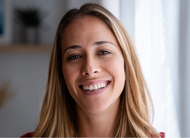 Smiling woman with clear, even-toned skin after an IPL photofacial