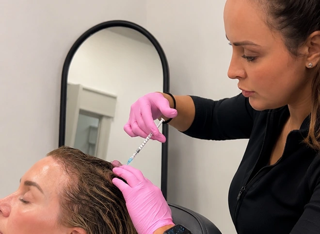 Provider injecting PRP into a patient's scalp for hair restoration